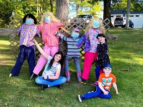 Even the scarecrows are playing it safe as part of Lansdowne Association For Revitalization's Scarecrow Sightings in Township of Leeds and the Thousand Islands. Human group members are Hailey and Ava Forbes with Quinn Richardson.  Supplied by Lansdowne Association For Revitalization