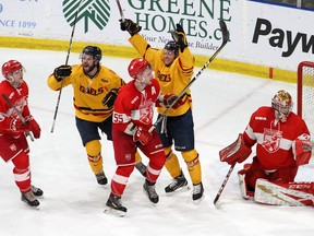 It doesn't appear that the Queen's Gaels will be playing the Royal Military College Paladins in February at the annual Carr-Harris Challenge Cup game at the Leon's Centre. In the 2019 game Ryan Cranford, left, and Jared Bethune celebrate the winning goal behind RMC Paladins goaltender Joey May, Dean Kiriacou (20) and Liam Murray at the Leon's Centre in Kingston on Thursday February 6, 2020. Queen's won 4-2.