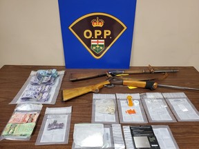 Police say they seized about $40,000 worth of drugs, cash and weapons after executing two search warrants in Kirkland Lake last week.