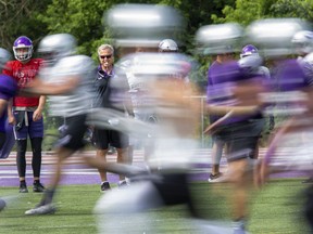 Head coach Greg Marshall puts players through their paces during Western Mustangs football practice at TD Stadium in London on Thursday August 22, 2019. (Derek Ruttan/The London Free Press)