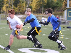 Julien Dube tries to outrun his opponents Saturday afternoon at the Steve Omischl Sports Field Complex during a game of flag football. 
Jennifer Hamilton-McCharles, The Nugget