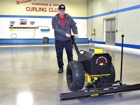 Terry Lang, head ice-maker at the PowassanÊ Curling Club,Ê expectsÊ the ice to be ready for players on Nov. 1Ê  Part of the preparation process involves shaving the ice (pictured) with a four-foot blade. 
Rocco Frangione Photo