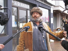 Shane Moyer speaks to reporters outside Nipissing-Timiskaming MP Anthony Rota's office, Friday, as he and others call for more support for the homeless. Michael Lee/The Nugget