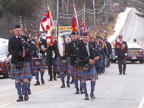 A parade marches up Astorville Road during the East Ferris Remembrance Day ceremony in November 2019. Nugget File Photo