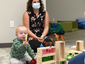 Programming is happening at Nipawin's Early Learning Resource Centre and this little one is learning fast, watched over by Lisa Vavra, the Centre's director. Photo Susan McNeil.