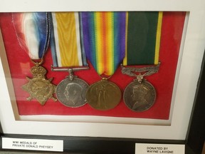 A photograph of some First World War medals, from left, 1914-1915 Star, British War Medal, Victory Medal and Territorial Efficiency Decoration.