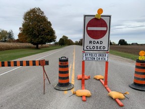 Police closed a section of Longwoods Road as part of a search for a suspect who fled the scene of a crash on Christina Road and Longwoods Road Wednesday morning. (DEREK RUTTAN, The London Free Press)