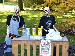 The Skeletons of Vivian Line are back in daily displays until Nov. 1. Pictured, the skeletons sanitize some surfaces and ensure they are social distancing from one another using a tape measure as part of Tuesday's pandemic-themed display. Galen Simmons/The Beacon Herald/Postmedia Network