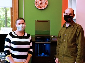 Stephanie Park, the Stratford Public Library's MakerSpace and marketing librarian, and MakerSpace assistant Eric Ball pose with a 3D printer in the library's Makerspace. 
(Galen Simmons/Beacon Herald file photo)