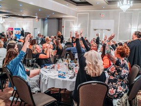 Optimism Place's 2020 Women of the Year Awards will be broadcast live via Zoom Friday evening beginning at 6 p.m. Pictured, attendees at the 2019 awards ceremony in the Arden park Hotel participate in the toonie auction. (Submitted photo)