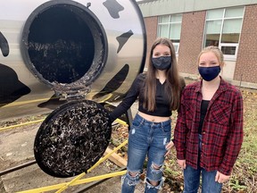 Stratford district secondary school Eco Club students, Melanie Broughton, left, and Sammie Orr, are part of the group that helped procure a ‘compost cow’ as part of the school’s many green initiatives. Cory Smith/The Beacon Herald