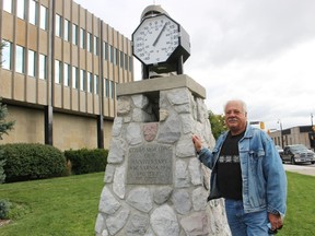 Sarnia Heritage Committee member Joe Salvatore stands beside the stone cairn by Sarnia city hall Friday. The thermometer atop the cairn was recently fixed, and plans are being made to landscape around the cairn in 2021. (Paul Morden/The Observer)