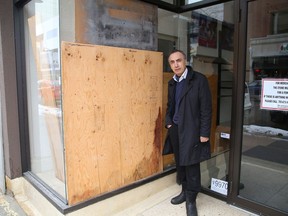 Tony Monteleone, of Monteleone clothing store, stands at the entrance to his store on Durham Street in Sudbury, Ont. where a break-in occurred at his business earlier this year. He says downtown merchants are concerned about the state of the city's core.