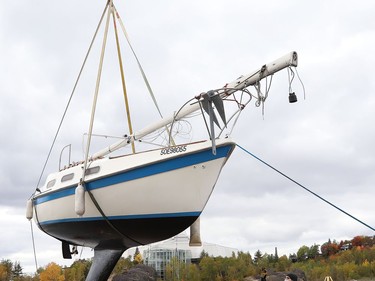 A crane was used to lift a sailboat out of Ramsey Lake at the Sudbury Yacht Club in Sudbury, Ont. on Friday October 2, 2020. The crane was used to remove all the boats from the water to wrap-up the sailing season. John Lappa/Sudbury Star/Postmedia Network