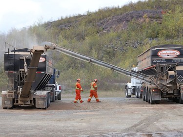 Lime is transferred to another truck as ValeÕs annual aerial seeding program wrapped up on Friday October 2, 2020, near the town of Wahnapitae. Helicopters from Zimmer Air Services applied fertilizer, grass seed and lime over a four-day period. Pioneer Construction provided the staging site for the project. The aerial seeding program targets barren land requiring reclamation around the companyÕs operations. The program, which started in 1990, has treated more than 3,900 hectares (9,650 acres) of land to date. This yearÕs treatment area was about 100 hectares (247 acres). Starting this weekend, Zimmer helicopters will apply lime to an area about one kilometre north of Vale's Copper Cliff central tailings area. John Lappa/Sudbury Star/Postmedia Network