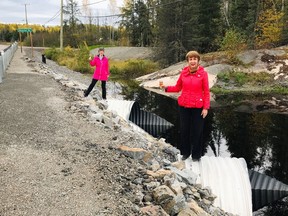 Nickel Belt MPP France Gelinas, foreground, and Ward 9 Coun. Deb McIntosh raise a glass of ginger ale to the completion of the Jumbo Creek rehabilitation project along Highway 537. The toast was five years in the making.