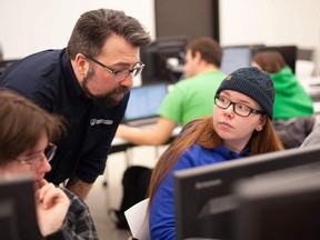 Professor Aaron Langille works with students during a class at Laurentian. Supplied