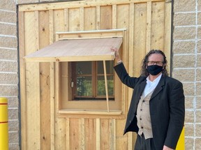 College Boreal professor Denis Ouimette demonstrates how students are gaining experience in the creation of energy-conserving window shutters. Supplied