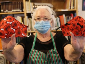 Sandra Sharko, president of the Ukrainian Seniors' Centre in Sudbury, Ont., displays poppy masks that are available for purchase at the centre. The masks are being made by Roma Shewciw and can be purchased for $10 a mask by calling 705-673-7404. All proceeds will be donated to local legions.