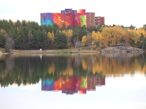 The old St. Joseph's Health Centre is reflected off of Ramsey Lake in Sudbury, Ont. on Thursday October 22, 2020.