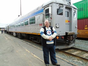 Daryl Adair of Winnipeg-based Rail Heritage Tours stands in front of the Budd car in Sudbury. PHOTO BY ANDRE RAMSHAW