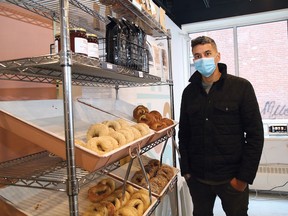 Justin Sawchuk, co-owner of Salty Dog Bagels in Sudbury, Ont., shows off a selection of bagels on Wednesday October 28, 2020. The owners are celebrating the first anniversary of their downtown storefront. John Lappa/Sudbury Star/Postmedia Network