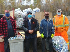 Pictured from left are Pierre Beaumier, Grand Knight (president); Ed Rouge, waste diversion technician, Wahnapitae First Nation; Rock Rousseau, Chevalier de Colomb; and Paul MacDonald, waste diversion coordinator, Wahnapitae First Nation employee. The Wahnapitae First Nation have been saving the pop and beer cans, beer bottles, the wine and liquor bottlse at its their landfill site to give to a worthy cause for a long time. This year they gave permission to the Chevalier de Colomb (Knights of Columbus) council from Ste-Anne des Pins parish, downtown, to collect and redeem them. The money will be used to assist needy families at Christmas. The Chevaliers de Colomb is a Catholic fraternal order with councils (branches) in thousands of parishes that work to better the lives of people who need help and support their parish priest in Canada, the USA, Mexico and some European countries. The council is now committed to provide funds to the NEO Kids Foundation.