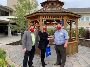 From the left are Marc Serre, MP Nickel Belt, Alicia Wood, CEO Covergalls Workwear, and Ray Ingriselli, Site Administrator Villa St. Gabriel Villa. As part of the Covergalls Workwear Canada-strong campaign, a portion of its Canadian-made fabric mask sales went towards the purchase of essential PPE for long-term care facilities. Wood was pleased to present $3,000 to Ingriselli. Supplied photo