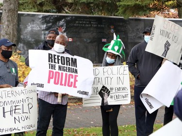 Members of the Nigerian community in Greater Sudbury and their supporters gathered in Memorial Park in Sudbury, Ontario on Saturday, October 17, 2020, for an End SARS, or #ENDSARS event, calling for the Nigerian government to end the deployment of the Special Anti-Robbery Squad, or SARS, a unit of the Nigerian Police Force and a controversial division known for police oppression and brutality. Nigerians have shared stories and video evidence of how SARS members have engaged in kidnapping, murder, theft, rape, torture, unlawful arrests, humiliation, unlawful detention, extrajudicial killings, and extortion. Protests in Nigeria have been violently oppressed, despite a recent announcement the Nigerian Police Force that it would dissolve SARS. Protests have spread around the world, with participants calling on the international community, including the Canadian government, to take action, and to push for sanctions against those who perpetrated the acts. For more information on Greater Sudbury's Nigerian community, visit www.facebook.com/thenigeriancommunitysudbury. Ben Leeson/The Sudbury Star/Postmedia Network