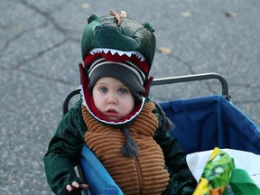 Charlie Neale, then 1, takes a break from trick or treating on Halloween in Sudbury, Ont. on Wednesday October 31, 2018. This year, due to the pandemic, Public Health Sudbury and Districts recommends wearing a face covering, using tongs to hand out candy, and maintaining physical distancing.
