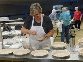 Cheryl McGuire, first vice president of the Moore Agricultural Society Homecraft Division, is preparing pies. A pie-making Thanksgiving fundraiser was held as the Brigden Fair was cancelled this year because of COVID-19. Handout