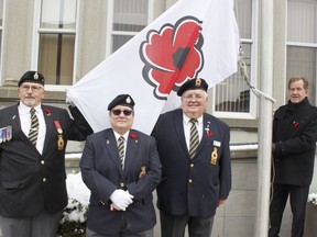 Royal Canadian Legion Branch 88 vice-president, treasurer and bugler Eugene St. Jean, from left, sergeant-at-arms and parade commander Andréa Villeneuve and service officer Ron MacInnis, were outside the city hall with Mayor George Pirie, to raise a flag bearing a poppy to promote the launch of the Legion's annual poppy campaign. 

RICHA BHOSALE/The Daily Press