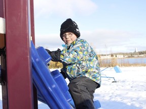 The cooler temperatures and white stuff on the ground didn't seem to make a difference to Martin Fortier, 4, who was happily climbing the playground structures at Gillies Lake park on a sunny Thursday afternoon.

RICHA BHOSALE/The Daily Press