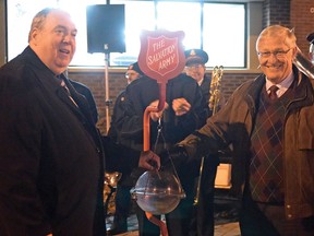 Dave Beres, Mayor of Tillsonburg in 2014, (left) and Oxford MPP Ernie Hardeman attended a Salvation Army kettle camptain kickoff ceremony in front of the Tillsonburg Library. There will be a kettle campaign this year in Tillsonburg, but there will be some changes. (Chris Abbott/File photo)