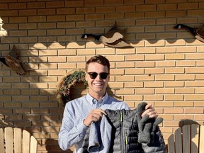 Kurtis David shows examples  of the clothing collected for his winter clothing drive to help local residents keep warm this winter. He will be having a door to door campaign on November 7 and would appreciate coats, hats, socks, boots, scarves or gloves.TP.jpg