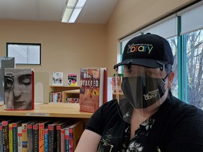 Ardis Chedore, Assistant to the CEO of the Cochrane Public Library dons a hat with the new logo that was launched on Monday as part of Ontario Public Library Week. The new design represents an updated brand to easily identifies what the industry is.TP.jpg