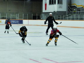 Tim Lindberg, coach of Sauce Hockey, ran power skating drills with Nanton Minor Hockey players last week at the Tom Hornecker Recreation Centre. COVID-19 rules, including masks being mandatory inside the THRC, are in place, and staff are doing cleaning in between uses of the arena.