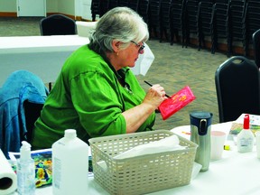 Pat Seifert led a Paint Day session Oct. 14 at the Champion Community Hall, providing instruction on painting a flower using acrylics. Before the painting session, those in attendance heard a presentation on elder abuse. Two more free Paint Day and elder abuse sessions are scheduled to take place, on Nov. 18 and Dec. 16. Anyone interested in attending needs to pre-register at a local library or by calling Rainbow Literacy and Learning Society at 403-485-3107.