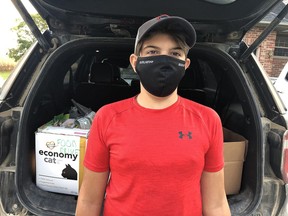 Rylan da Costa is shown collecting for the Community Wide Food Drive in Dutton Dunwich and West Elgin in September. (Handout/Postmedia Network)