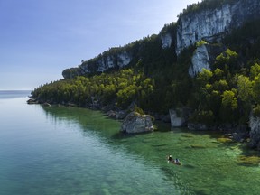 Towering limestone cliffs fall into crystal clear waters on the Bruce Peninsula, one of the many
spectacular areas of Ontario’s Niagara Escarpment. Photo supplied.