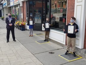 Brant Mayor David Bailey with three local heroes, Colin Vanderpols, Josh Robinson and Carson Vanderpols.