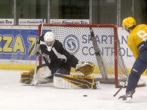 Grande Prairie Storm goalie Lars Kaliel stretches to make a save during Monday afternoon practice at Revolution Place. The Storm finish up the Alberta Junior Hockey League exhibition season this weekend with a pair of road games against the Olds Grizzlys.