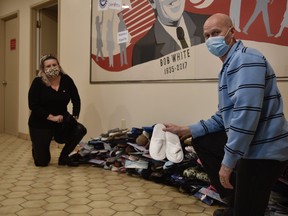 Melissa Holden, vice-president of Unifor Local 636 (left), and Brent Thompson, president (right). The union is collecting slippers marking the 2,000 deaths in long-term care homes in Canada since the start of the COVID-19 pandemic. (Kathleen Saylors/Woodstock Sentinel-Review)