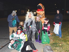 Photo by KEVIN McSHEFFREY/THE STANDARD
Saturday saw ghost, goblins, zombies, princesses, dinosaurs and more roaming the streets of Elliot Lake for Halloween. While some reported large number of trick ‘r’ treaters going door to door, others reported having very few an stuck with plenty of candy. This group of youngsters and their guardians, on Central Avenue, were just a few who were scouring the city for sweet treats.