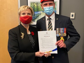 Mayor Gale Katchur, left, and vice president of the Fort Saskatchewan Legion proclaimed October 30 to November 11, 2020 as Poppy Days. Photo Supplied by the City of Fort Saskatchewan
