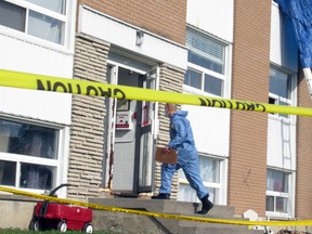 Ontario Provincial Police investigate Wednesday evening's fatal fire in Amherstview on Thursday. (Elliot Ferguson/The Whig-Standard)