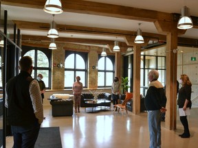Members of Heritage Stratford met with local developers Paul and Elena Veldman in the front lobby of the recently restored Bradshaw building at 245 Downie St. Thursday morning to present them with the 2019 James Anderson Award for their work restoring the building and transforming it into residential, school and work spaces. Galen Simmons/The Beacon Herald/Postmedia Network