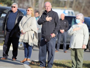 Mourners pay their respects to the late Carmen Marrelli as his funeral procession passes by Canadian Motor Hotel on Pim Street in Sault Ste. Marie, Ont., on Thursday, Nov. 5, 2020. (BRIAN KELLY/THE SAULT STAR/POSTMEDIA NETWORK)