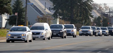 Funeral procession of the late Carmen Marrelli approaches Canadian Motor Hotel on Pim Street in Sault Ste. Marie, Ont., on Thursday, Nov. 5, 2020. (BRIAN KELLY/THE SAULT STAR/POSTMEDIA NETWORK)