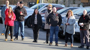 Mourners pay their respects to the late Carmen Marrelli as his funeral procession passes by Canadian Motor Hotel on Pim Street in Sault Ste. Marie, Ont., on Thursday, Nov. 5, 2020. (BRIAN KELLY/THE SAULT STAR/POSTMEDIA NETWORK)